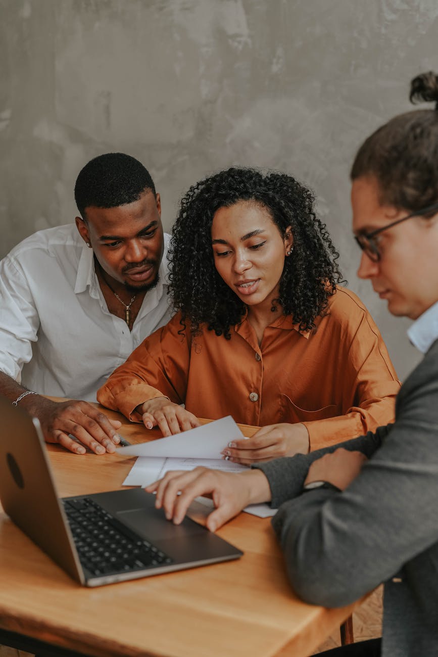 a man and woman holding documents
